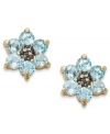 Spring forward. Victoria Townsend's sweet flower studs feature round-cut blue topaz (1-1/3 ct. t.w.) set in 18k gold over sterling silver. Approximate diameter: 3/8 inch.