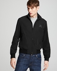 This slick-meets-sporty bomber jacket from Burberry Brit lends an effortless layer to transitional seasons. This slick-meets-sporty bomber jacket from Burberry Brit lends an effortless layer to transitional seasons.