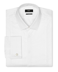 A slim fit tuxedo dress shirt with intricate pintuck detail in front. Covered placket except top button showing, tonal textured stripes. Small point collar. French cuffs. A slim fit tuxedo dress shirt with intricate pintuck detail in front. Covered placket except top button showing, tonal textured stripes. Small point collar. French cuffs.