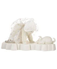 This bundled Snowbaby stares in wonderment at a sweet pup in this cherished figurine from Department 56. Crafted of porcelain bisque with glitter details. This bundled Snowbaby stares in wonderment at a sweet pup in this cherished figurine from Department 56. Crafted of porcelain bisque with glitter details.