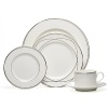 Vows dinner plate by Lauren Ralph Lauren Home. Inspired by the graceful curves of wedding rings, this elegant dinnerware line features interconnected platinum bands on the finest bone china. Makes a stunning table for any special occasion.