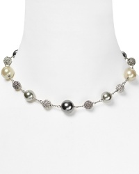 Embellished with delicate pearl and crystal stations, Carolee's illusion necklace sparkles with versatility -- elegant whether worn to dress up denim or enliven a classic white blouse. Embellished with delicate pearl and crystal stations, Carolee's illusion necklace sparkles with versatility -- elegant whether worn to dress up denim or enliven a classic white blouse.