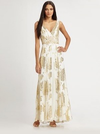 This beautifully draped floor-length style is enhanced by allover metallic jacquard.V necklineSleevelessFront slitLow backConcealed side zipFully linedAbout 48 from natural waist85% silk/10% polyester/5% lurexSpot cleanImportedModel shown is 5'10½ (179cm) wearing US size 4. This beautifully draped floor-length style is enhanced by allover metallic jacquard.V necklineSleevelessFront slitLow backConcealed side zipFully linedAbout 48 from natural waist85% silk/10% polyester/5% lurexSpot cleanImportedModel shown is 5'10½ (179cm) wearing US size 4.