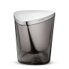 The ice bucket keeps drinks cool in style. The ice bucket is crafted in polished stainless steel and unusual smoke-coloured mouth-blown glass. The shape encourages the bottle to lean at a slight angle for maximum chilling. It is dishwasher safe. The ice bucket is a beautiful addition to any bar or dining room table.