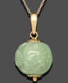 Subtle and symbolic. A simple jade bead (11-12 mm) creates a stunning visual with an intricate dragon carved into the surface. Set in 14k gold. Approximate length: 18 inches. Approximate drop: 1 inch.