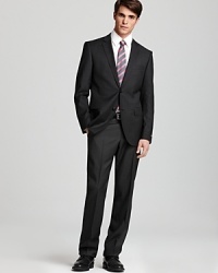 A gallant suit in season-spanning wool cuts a handsome figure whether you wear it to the office, as a wedding guest or to your off-hours evening affairs. Featuring a slimmer fit for modern appeal. A gallant suit in season-spanning wool cuts a handsome figure whether you wear it to the office, as a wedding guest or to your off-hours evening affairs. Featuring a slimmer fit for modern appeal.