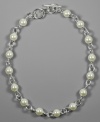 Pleasing glass pearls look positively pretty on this AK Anne Klein necklace complete with silvertone mixed metal. Approximate length: 17 inches.
