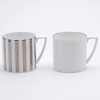 Jasper Conran continues to close the gap between formal dining and casual living. He accents the contemporary beauty of his already popular white bone china range with a touch of formality in the forum of a thin platinum band. To create an interplay of proportions, accent pieces including a plate, a charger, a small pitcher, mug, teacup and saucer, use thick platinum stripes to reinforce the pattern's look of sophisticated elegance. Jasper Conran continues to close the gap between formal dining and casual living. He accents the contemporary beauty of his already popular white bone china range with a touch of formality in the forum of a thin platinum band. To create an interplay of proportions, accent pieces including a plate, a charger, a small pitcher, mug, teacup and saucer, use thick platinum stripes to reinforce the pattern's look of sophisticated elegance.