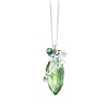 Sparkling Swarovski crystal in a rich peridot hue is embellished with silvery metal details, dangling charms and a small jingling bell to create this festive Christmas ornament.