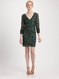 Allover sequins give this evening style special shimmer.V-neckline Ruched, sheer sleeves Concealed back zip Fully lined About 19 from natural waist Polyester Spot clean Imported Allover sequins give this evening style special shimmer.V-neckline Ruched, sheer sleeves Concealed back zip Fully lined About 19 from natural waist Polyester Spot clean Imported