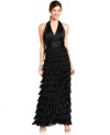 JS Collection's gown is unforgettable with a chic halter-neck style and long skirt full of feathered tiers.