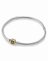Mixed metals look chic on Pandora's sterling silver bracelet with a 14K gold signature clasp.