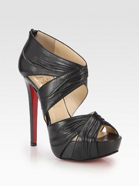 Bands of ruched leather form this sexy silhouette with a sky-high heel and platform. Self-covered heel, 5½ (140mm)Covered platform, 1½ (40mm)Compares to a 4 heel (100mm)Leather upperBack zipLeather liningSignature red leather solePadded insoleMade in Italy Bands of ruched leather form this sexy silhouette with a sky-high heel and platform. Self-covered heel, 5½ (140mm)Covered platform, 1½ (40mm)Compares to a 4 heel (100mm)Leather upperBack zipLeather liningSignature red leather solePadded insoleMade in Italy