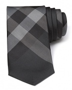 Crafted in luxe Italian silk, Burberry London's Rohan tie flaunts the classic check pattern in a narrower cut.