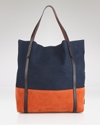 In a modern color-block design, this roomy Burberry tote is ideal for both errands and travel.