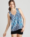 Trend-right tribal print and a gold back zipper lend statement status to this Aqua tank, downtown-cool with black denim and an open-toe bootie.