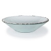 After a hammered edge is carefully created around the circumference of this richly textured glass bowl, craftsmen hand-paint an opulent band of platinum for a breathtaking finish.
