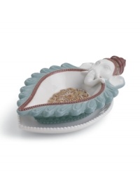 Diwali and Ganesha go hand in hand with this intricate porcelain diya from Lladro. An ornate flower design inside complements colorful trim on the exterior. Diwali and Ganesha go hand in hand with this intricate porcelain diya from Lladro. An ornate flower design inside complements colorful trim on the exterior.
