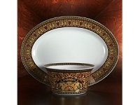 Gianni Versace's artistic influence in the world of fashion was virtually unparalleled. His legacy is carried on and translated for the table in its marriage with Rosenthal. Versace by Rosenthal is an extraordinary collection resulting in high quality tableware and giftware in contemporary designs. Elegant red, precious gold and black unite on the Medusa dinnerware, forming ingenious patterns worthy of the most opulent feast. Gianni Versace's artistic influence in the world of fashion was virtually unparalleled. His legacy is carried on and translated for the table in its marriage with Rosenthal. Versace by Rosenthal is an extraordinary collection resulting in high quality tableware and giftware in contemporary designs. Elegant red, precious gold and black unite on the Medusa dinnerware, forming ingenious patterns worthy of the most opulent feast.