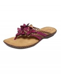 Petal power: Flaunt a fresh pedicure with the floral-accented Brisk Juniper thong sandals by Clarks. With a padded sole for extra-comfort, you'll feel like you're walking on roses all day long. Petal power: Flaunt a fresh pedicure with the floral-accented Brisk Juniper thong sandals by Clarks. With a padded sole for extra-comfort, you'll feel like you're walking on roses all day long.