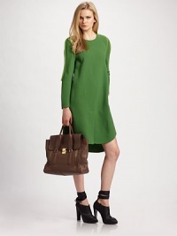 An effortless shift rendered in a lightweight wool, framed with tonal binding for a contemporary edge.Jewel neckline Long sleeves Front vent Shirttail hem About 37 from shoulder to hem Wool; dry clean Imported An effortless shift rendered in a lightweight wool, framed with tonal binding for a contemporary edge.Jewel neckline Long sleeves Front vent Shirttail hem About 37 from shoulder to hem Wool; dry clean Imported