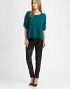 Slouchy-chic sweater in a wool and angora blend with dropped shoulders and a slight scoopback. Ribbed scoopneckDropped shouldersLong sleevesRibbed cuffs and hemPleated back50% wool/50% angoraDry cleanImportedModel shown is 5'10 (177cm) wearing US size Small.