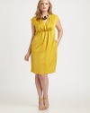 A vibrant sheath featuring a feminine neckline and convenient slash pockets. The gathered, Empire waist offers an undeniably flattering silhouette.V-neckCap sleevesEmpire waistSlash pocketsConcealed back zipperWaist dartsAbout 21 from natural waistPolyesterHand washImported
