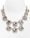 Paint the town gold with this kate spade new york statement necklace, accented by a bib of bold crystal stone stations. It's a luxe layering piece.