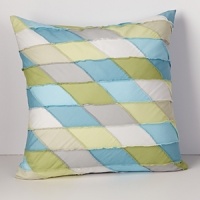 Diagonal patchwork pillow with topstitching detail. A stylish pillow, great for a modern bedroom or living room.