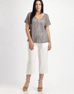 Shimmer and shine in this airy knit enhanced by metallic thread. It also features a feminine neckline and beloved fit.V-neckShort sleevesPull-on styleAbout 23 from shoulder to hem83% linen/16% metallic thread/1% cottonHand washImported of Italian fabric