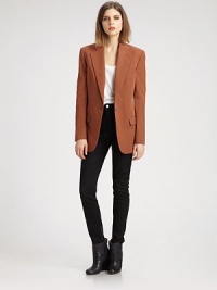 The single-breasted blazer, impeccably tailored in an oversized silhouette that boasts defined shoulders and a nipped waist.Notch collarWelt pocketsBodice dartsSingle button closureHip flap pocketsDouble back ventsAbout 29 from shoulder to hemCottonDry cleanImportedModel shown is 5'10 (177cm) wearing US size 4.