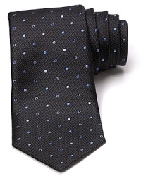 A pindot background is offset by a second pattern of alternating dots for an auspicious addition to your professional wardrobe. A pindot background is offset by a second pattern of alternating dots for an auspicious addition to your professional wardrobe.