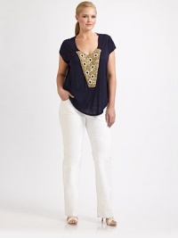 Sapphire and golden embellishments add a decidedly luxe feel to this everyday classic.ScoopneckShort sleevesStunning, embellished detailCurved hemAbout 36 from shoulder to hemRayon/spandexDry cleanMade in USA Sapphire and golden embellishments add a decidedly luxe feel to this everyday classic.ScoopneckShort sleevesStunning, embellished detailCurved hemAbout 36 from shoulder to hemRayon/spandexDry cleanMade in USA