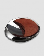 Inspired by the meeting of the sun and moon, this innovative metal alloy and cherry wood design combines a bowl and a board for both cutting and serving. Comes in Nambé blue gift box 14 Dia Hand wash gently Imported