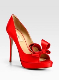 A perfectly-placed dimensional bow tops this towering peep toe silhouette, rendered in luxurious Italian satin. Self-covered heel, 5 (125mm)Covered platform, 1 (25mm)Compares to a 4 heel (100mm)Peep toeSatin upperLeather lining and solePadded insoleMade in Italy A perfectly-placed dimensional bow tops this towering peep toe silhouette, rendered in luxurious Italian satin. Self-covered heel, 5 (125mm)Covered platform, 1 (25mm)Compares to a 4 heel (100mm)Peep toeSatin upperLeather lining and solePadded insoleMade in Italy