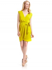 THE LOOKGathered detail along shouldersSurplice V-neckTie waistMock wrap front skirt with cascading ruffle detailTHE FITAbout 36 from shoulder to hemTHE MATERIALPolyesterCARE & ORIGINDry cleanMade in ItalyModel shown is 5'9½ (176cm) wearing US size 4. THE LOOKGathered detail along shouldersSurplice V-neckTie waistMock wrap front skirt with cascading ruffle detailTHE FITAbout 36 from shoulder to hemTHE MATERIALPolyesterCARE & ORIGINDry cleanMade in ItalyModel shown is 5'9½ (176cm) wearing US size 4.