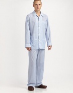 Lounge around all night and day in this luxuriously soft cotton two-piece set with piping for a classic feel. Machine wash. Imported.SHIRTButtonfrontSpread collarChest, waist patch pocketsPANTSFlat-front styleAdjustable two-button waistSide elastic waist insetsNo flyInseam, about 31