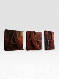 Handcarved wood block paperweights are detailed with solid brass plates on the bottoms, each etched with Assouline logo. Each: 4 X 4½ X 1¼ Made in USA