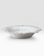 A beautiful stoneware bowl is handcrafted with elegant curves to bring rustic detail and irresistibly romantic European charm to a dinner or party. 80-ounce capacity 5H X 15½ diam. Dishwasher and oven safe Imported