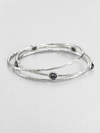 From the Rock Candy® Collection. A trio of hammered, sterling silver bangles accented with rich, faceted hematite. Sterling silverHematiteDiameter, about 2.5Slip-on styleImported From the Rock Candy® Collection. A trio of hammered, sterling silver bangles accented with rich, faceted hematite. Sterling silverHematiteDiameter, about 2.5Slip-on styleImported