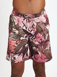 Summery, floral style for the beach and beyond in smooth, quick-drying nylon.Elastic drawstring waistSide slash, back welt pocketsInseam, about 7NylonMachine washImported Summery, floral style for the beach and beyond in smooth, quick-drying nylon.Elastic drawstring waistSide slash, back welt pocketsInseam, about 7NylonMachine washImported