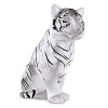 Sitting tiger figuring by Lalique. This impressive numbered edition piece balances the strength and virility of the tiger with its delicate feline grace. Expertly crafted in crystal with hand-painted black enamel stripes and details.
