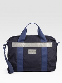 Tote your devices on the train, plane and beyond in this sporty shoulder bag with plenty of zip pocket details.Zip closureTop handlesAttached shoulder strapExterior, interior pockets18W x 13H x 1½DNylonImported Tote your devices on the train, plane and beyond in this sporty shoulder bag with plenty of zip pocket details.Zip closureTop handlesAttached shoulder strapExterior, interior pockets18W x 13H x 1½DNylonImported