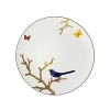 Embellished with a blue-breasted songbird and a duo of butterflies, this nature-inspired porcelain coupe dinner plate from Bernardaud brings an elegantly fanciful look to your table.