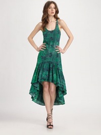 Distressed floral print highlights this shapely silk stunner finished with a contour ruffle hem.ScoopneckStraps crossover in backDropped waistContour hemAbout 30 from natural waistSilkDry cleanImportedModel shown is 5'10 (177cm) wearing US size Small. Distressed floral print highlights this shapely silk stunner finished with a contour ruffle hem.ScoopneckStraps crossover in backDropped waistContour hemAbout 30 from natural waistSilkDry cleanImportedModel shown is 5'10 (177cm) wearing US size Small.