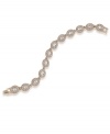 Glittering glass crystals in a distinctive oval shape adorn this elegant bracelet from Carolee. It's sure to add glamour to your workday wardrobe and dress up your ensemble for a special occasion. Made in gold tone mixed metal. Approximate length: 7 inches.