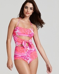 Dare to bare it with this cut out one piece from Nanette Lepore. Its bold print and revealing details define statement making, so wear this suit to make waves on the beach. Dare to bare it with this cut out one piece from Nanette Lepore. Its bold print and revealing details define statement making, so wear this suit to make waves on the beach.