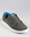 With vivid blue trim and lining and a soft suede upper, this unique low top design rests upon a lightweight cup sole for sporty comfort and style.