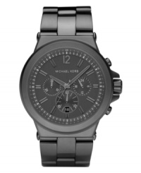 Shadowy in gunmetal tones, this chronograph watch from Michael Kors adds edge to your wardrobe. Shadowy in gunmetal tones, this chronograph watch from Michael Kors adds edge to your wardrobe.