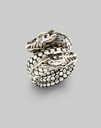 From the Naga Collection. A powerful dragon with dotted scales coils around the finger in this dramatic design. Sterling silver Width, about ¾ Made in Bali